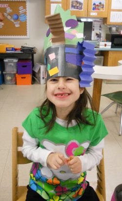 little girl wearing a crazy hat for crazy hat day at Cotting School